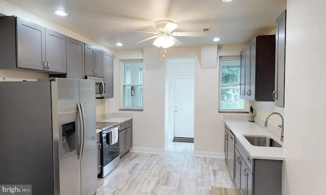 75 New York Ave NW, Washington, DC 20001 - kitchen featuring appliances with stainless steel finishes, a ceiling fan, gray cabinetry, light countertops, and recessed lighting