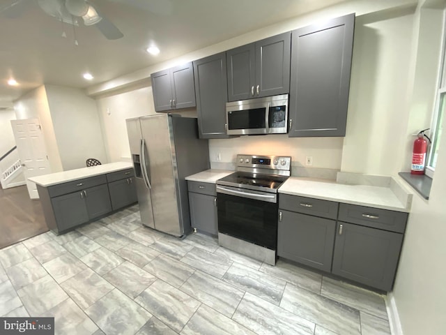75 New York Ave NW, Washington, DC 20001 - kitchen with appliances with stainless steel finishes, light countertops, gray cabinets, a ceiling fan, and recessed lighting