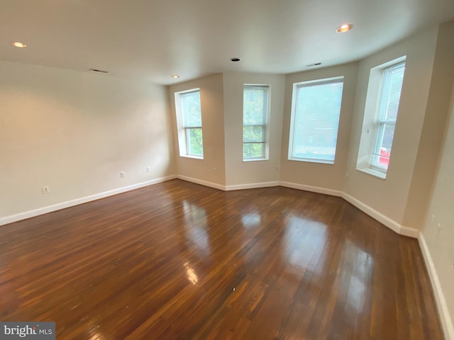 75 New York Ave NW, Washington, DC 20001 - unfurnished room featuring dark wood-style floors and recessed lighting