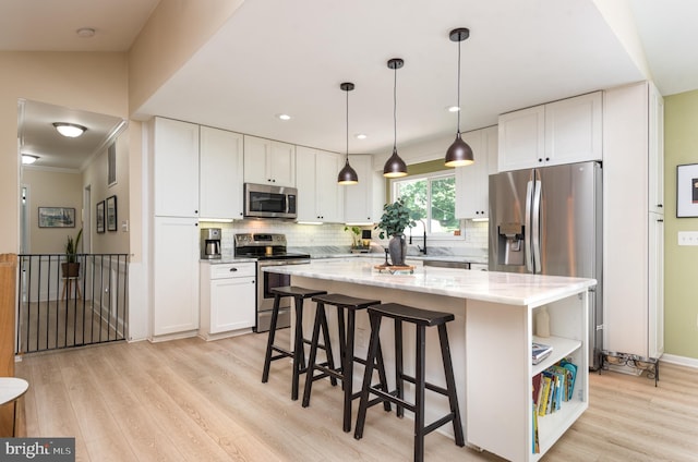 6444 Duhollow Rd, Warrenton, VA 20187 - kitchen featuring stainless steel appliances, light wood finished floors, light stone countertops, white cabinetry, and recessed lighting