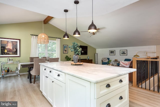6444 Duhollow Rd, Warrenton, VA 20187 - kitchen with light wood-type flooring, a center island, white cabinets, decorative light fixtures, and light stone countertops