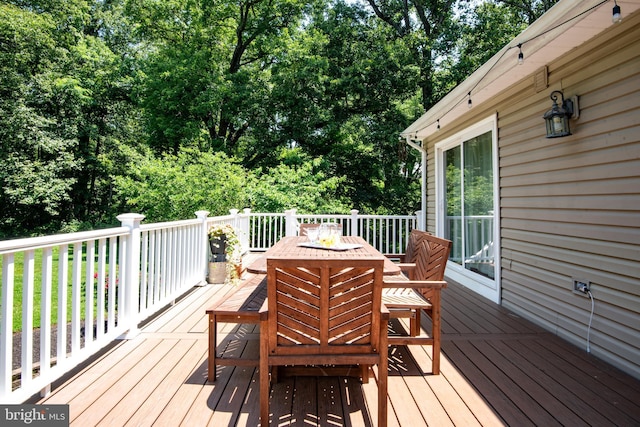 6444 Duhollow Rd, Warrenton, VA 20187 - wooden deck with a fire pit, outdoor dining space, and view of scattered trees