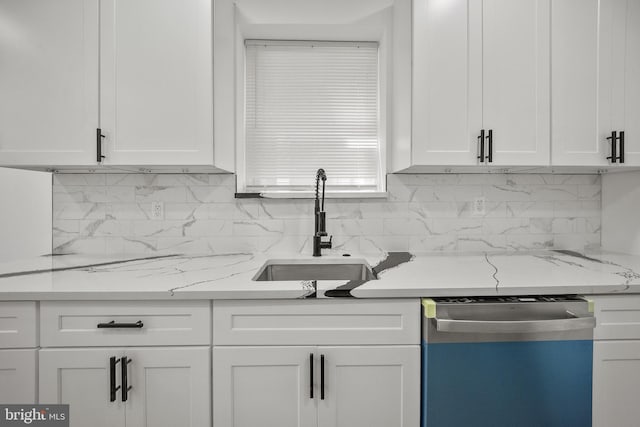 239 Rubicam St, Philadelphia, PA 19120 - kitchen featuring dishwasher, white cabinets, and tasteful backsplash