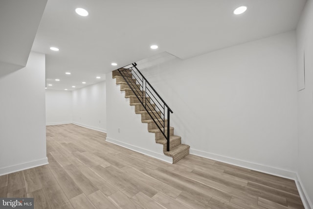 239 Rubicam St, Philadelphia, PA 19120 - staircase featuring wood finished floors and recessed lighting
