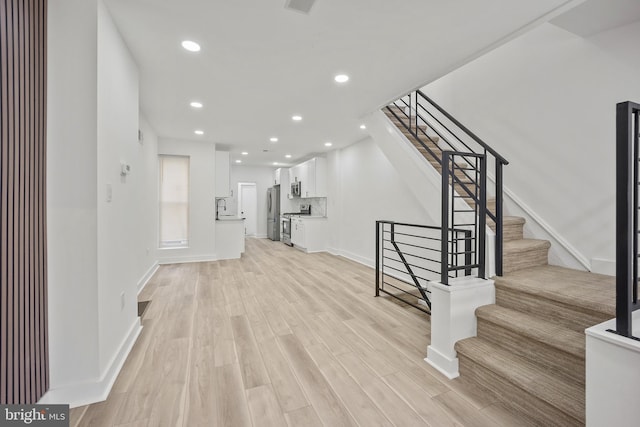 239 Rubicam St, Philadelphia, PA 19120 - entryway featuring stairs, light wood-style flooring, and recessed lighting
