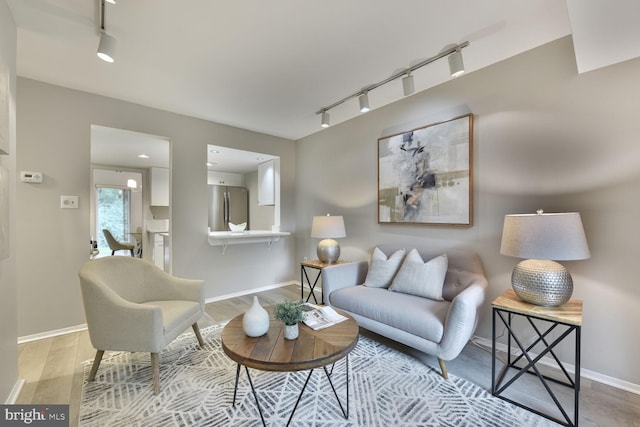 1814 Ivy Oak Sq, Reston, VA 20190 - living area with track lighting and light wood-type flooring