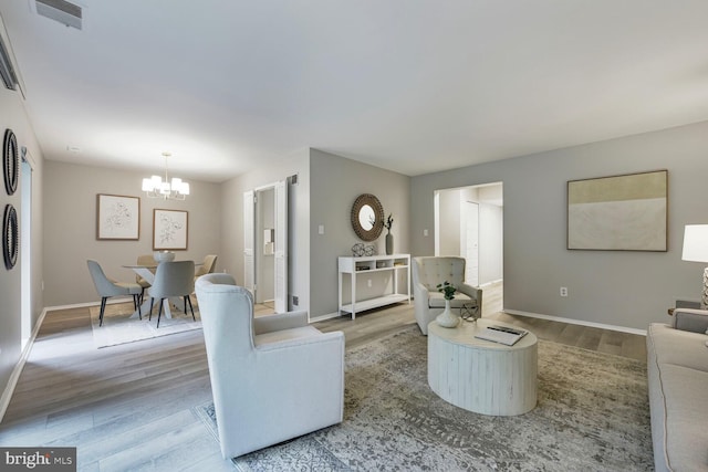 1814 Ivy Oak Sq, Reston, VA 20190 - living area featuring a chandelier and wood finished floors
