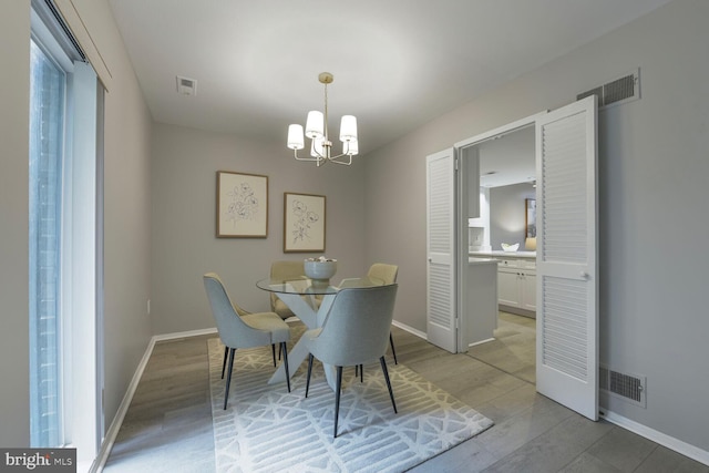1814 Ivy Oak Sq, Reston, VA 20190 - dining space featuring a chandelier and light wood-type flooring