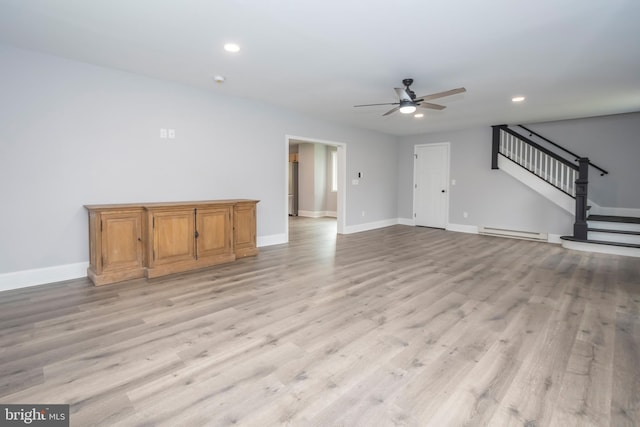 511 E Green St, Oakland, MD 21550 - unfurnished living room with a baseboard radiator, ceiling fan, recessed lighting, stairway, and light wood-style flooring