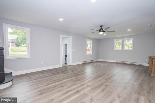 511 E Green St, Oakland, MD 21550 - unfurnished living room featuring baseboard heating, ceiling fan, recessed lighting, and wood finished floors