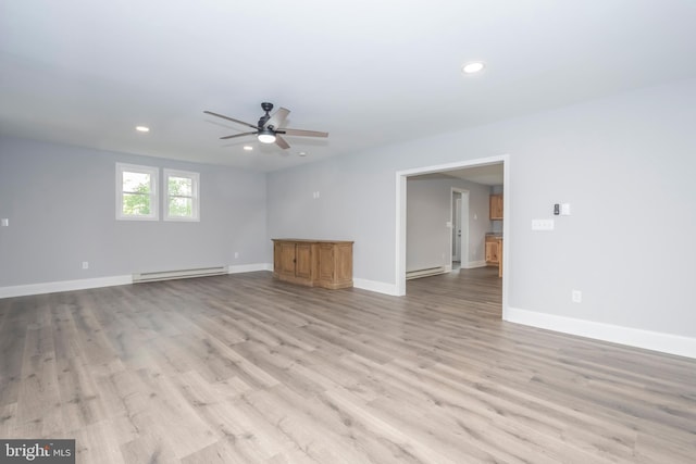 511 E Green St, Oakland, MD 21550 - spare room with a baseboard radiator, ceiling fan, recessed lighting, and light wood finished floors