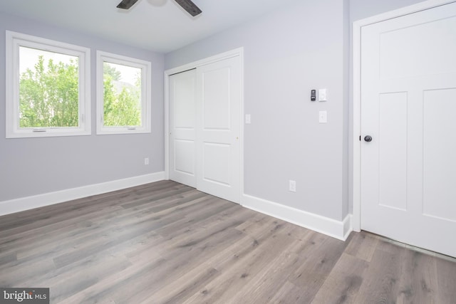 511 E Green St, Oakland, MD 21550 - unfurnished bedroom with wood finished floors, a closet, and a ceiling fan