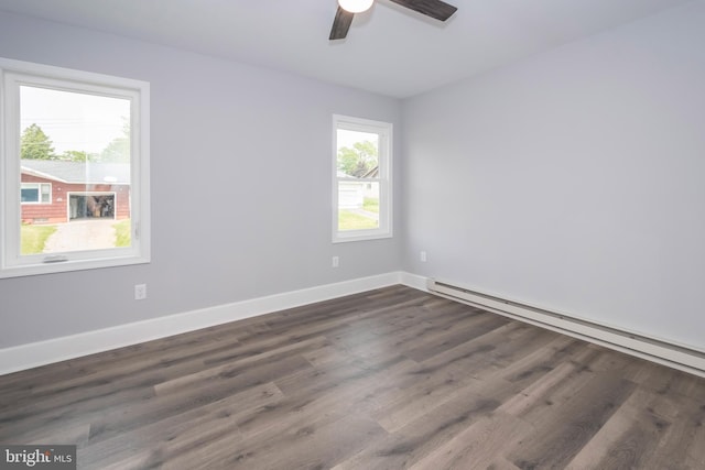 511 E Green St, Oakland, MD 21550 - empty room featuring ceiling fan, baseboard heating, and dark wood-style flooring