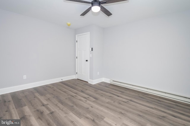 511 E Green St, Oakland, MD 21550 - spare room with wood finished floors, a ceiling fan, a baseboard radiator, and a smoke detector