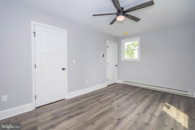 511 E Green St, Oakland, MD 21550 - spare room with a baseboard radiator, ceiling fan, and wood finished floors
