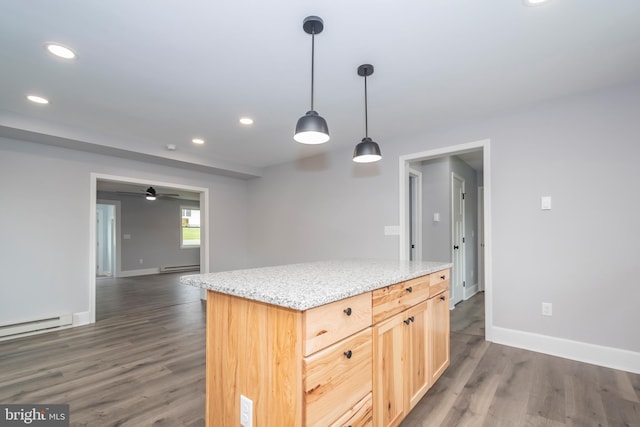 511 E Green St, Oakland, MD 21550 - kitchen with a baseboard radiator, dark wood-type flooring, recessed lighting, hanging light fixtures, and light stone countertops