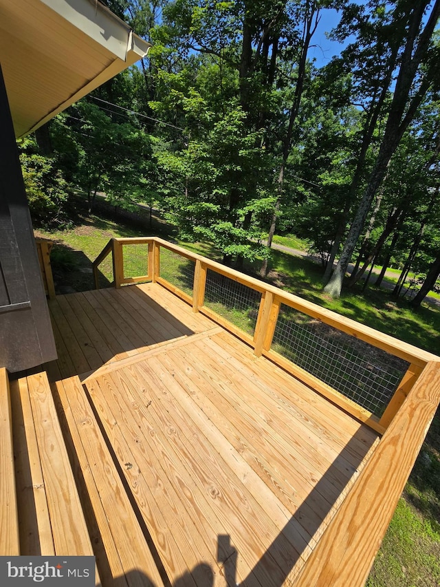 556 Trapper Ridge Ln, Hedgesville, WV 25427 - wooden deck featuring view of wooded area