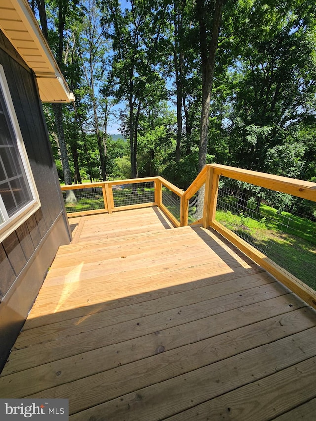 556 Trapper Ridge Ln, Hedgesville, WV 25427 - wooden terrace with view of wooded area