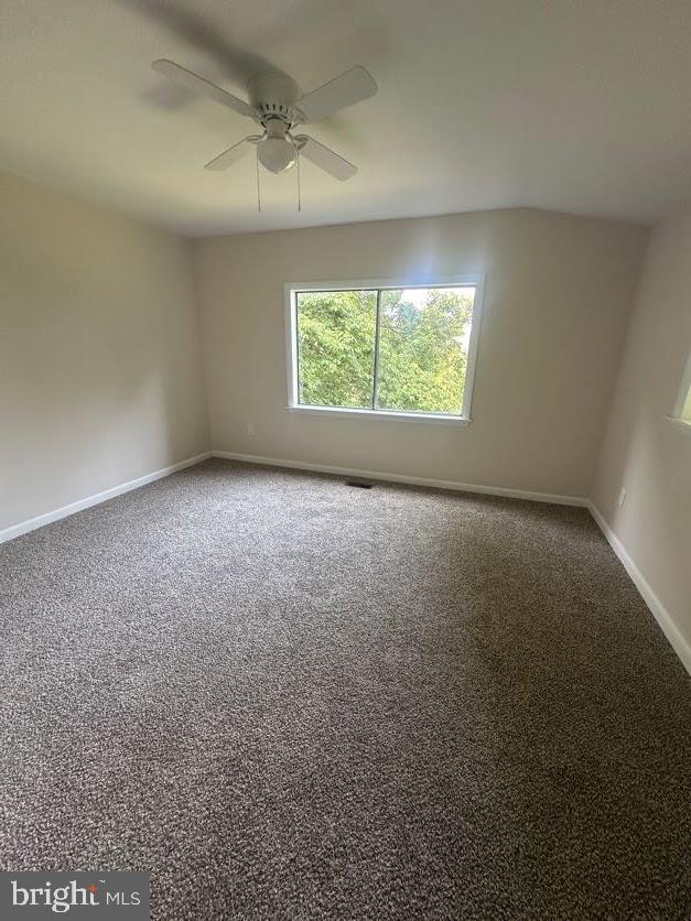 556 Trapper Ridge Ln, Hedgesville, WV 25427 - carpeted spare room with baseboards and ceiling fan
