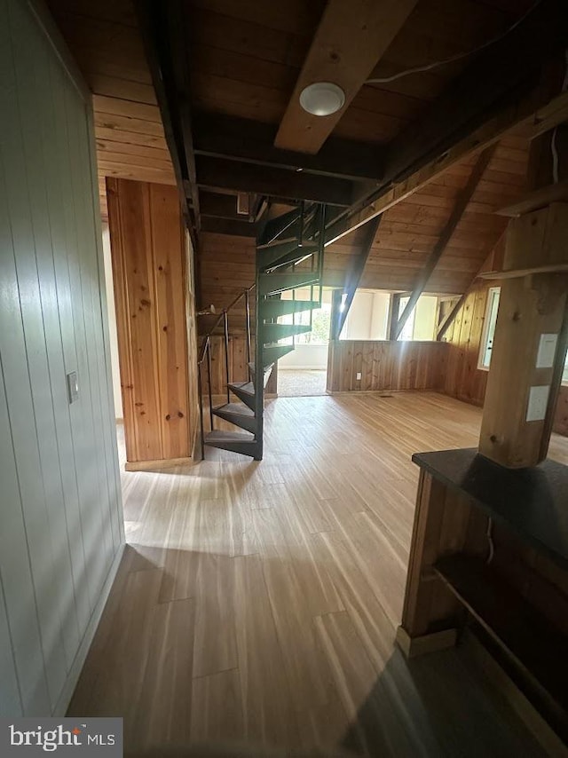 556 Trapper Ridge Ln, Hedgesville, WV 25427 - hall with wood walls, wood finished floors, stairs, wooden ceiling, and vaulted ceiling