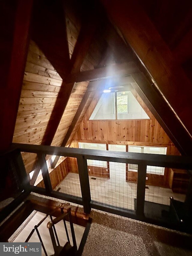 556 Trapper Ridge Ln, Hedgesville, WV 25427 - bonus room featuring wood walls and lofted ceiling