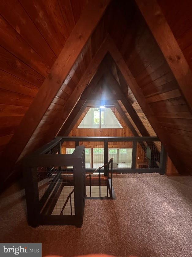 556 Trapper Ridge Ln, Hedgesville, WV 25427 - unfinished attic featuring an upstairs landing