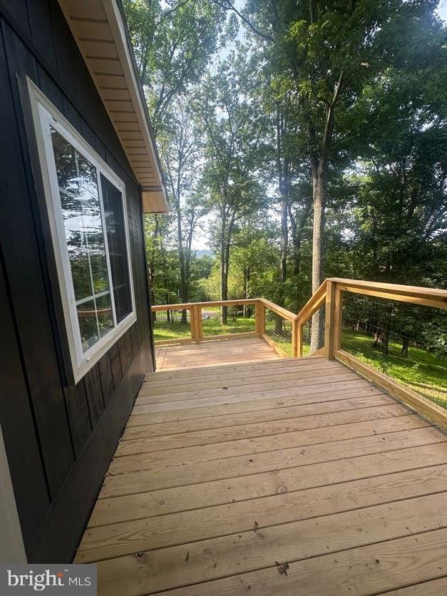 556 Trapper Ridge Ln, Hedgesville, WV 25427 - deck featuring view of wooded area