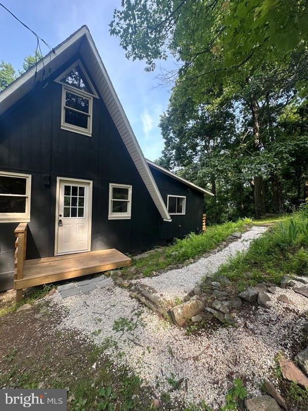 556 Trapper Ridge Ln, Hedgesville, WV 25427 - back of house featuring board and batten siding