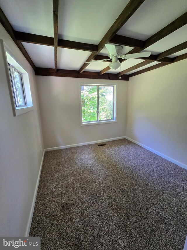 556 Trapper Ridge Ln, Hedgesville, WV 25427 - carpeted empty room with ceiling fan, coffered ceiling, and beam ceiling