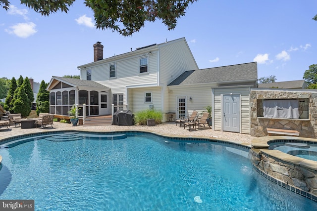 5304 Braddock Ridge Dr, Centreville, VA 20120 - view of swimming pool featuring a sunroom, a patio area, grilling area, a pool with connected hot tub, and an outdoor fire pit