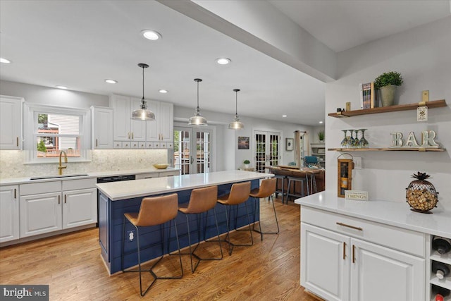 5304 Braddock Ridge Dr, Centreville, VA 20120 - kitchen featuring open shelves, white cabinetry, light countertops, backsplash, and recessed lighting