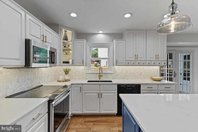 5304 Braddock Ridge Dr, Centreville, VA 20120 - kitchen with stainless steel appliances, white cabinetry, backsplash, and recessed lighting