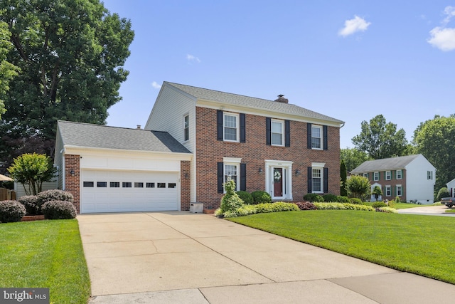 5304 Braddock Ridge Dr, Centreville, VA 20120 - colonial-style house featuring an attached garage, a chimney, brick siding, a front yard, and driveway