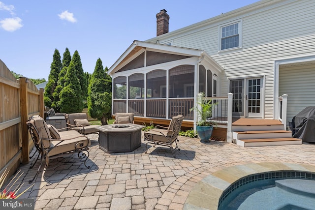 5304 Braddock Ridge Dr, Centreville, VA 20120 - view of patio / terrace with a sunroom, a fire pit, and grilling area