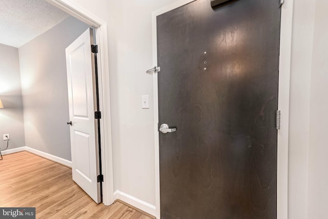 1111 25th St NW Unit 521, Washington, DC 20037 - corridor featuring light wood finished floors and baseboards