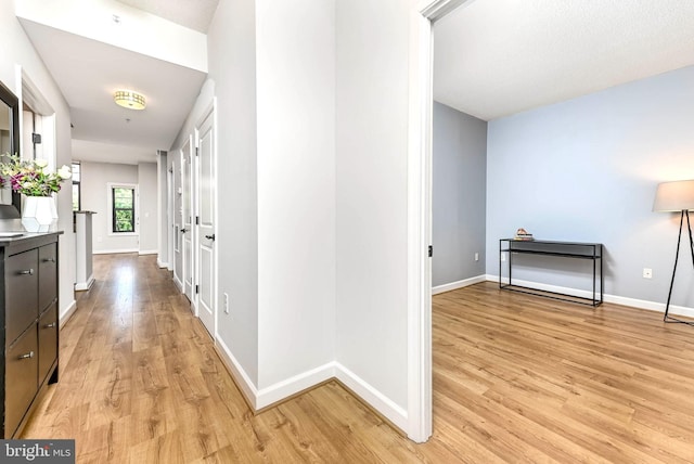 1111 25th St NW Unit 521, Washington, DC 20037 - hall with light wood-type flooring and baseboards
