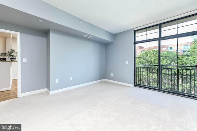 1111 25th St NW Unit 521, Washington, DC 20037 - spare room featuring carpet and floor to ceiling windows