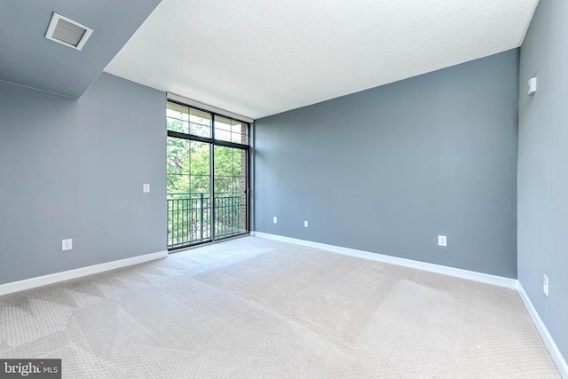 1111 25th St NW Unit 521, Washington, DC 20037 - carpeted spare room with floor to ceiling windows and a textured ceiling