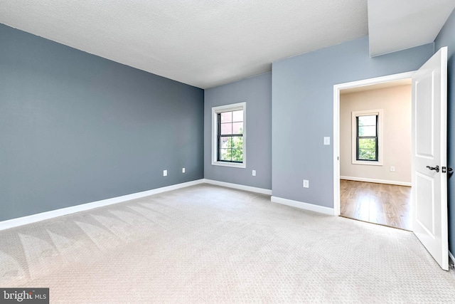 1111 25th St NW Unit 521, Washington, DC 20037 - carpeted spare room featuring baseboards