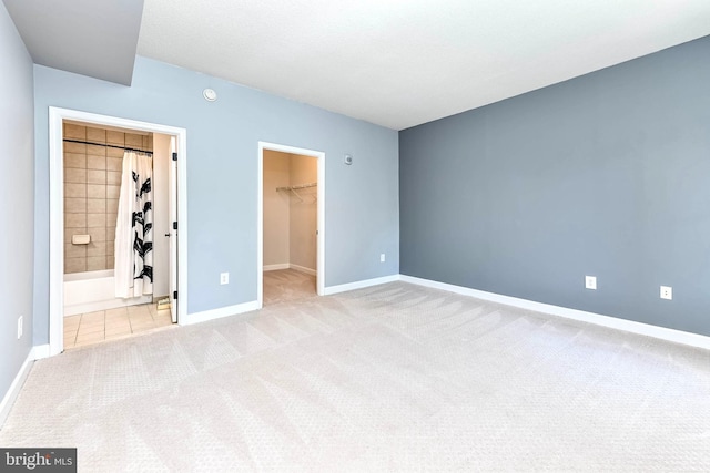 1111 25th St NW Unit 521, Washington, DC 20037 - unfurnished bedroom featuring a spacious closet, carpet, and a closet