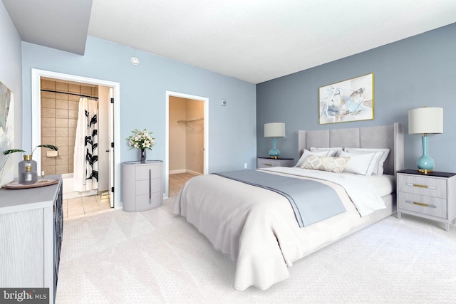 1111 25th St NW Unit 521, Washington, DC 20037 - bedroom with light colored carpet, a walk in closet, and a closet