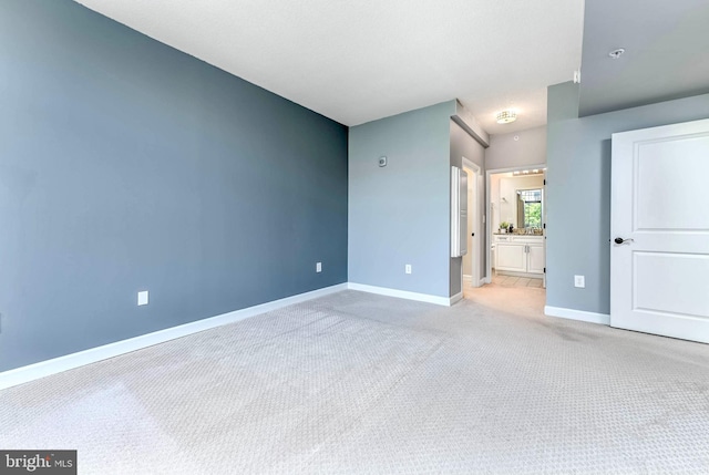 1111 25th St NW Unit 521, Washington, DC 20037 - unfurnished bedroom featuring light colored carpet and ensuite bathroom