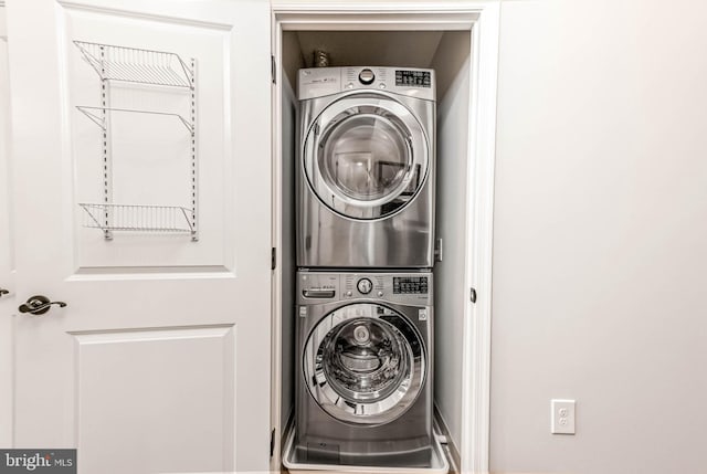 1111 25th St NW Unit 521, Washington, DC 20037 - washroom featuring estacked washer and dryer