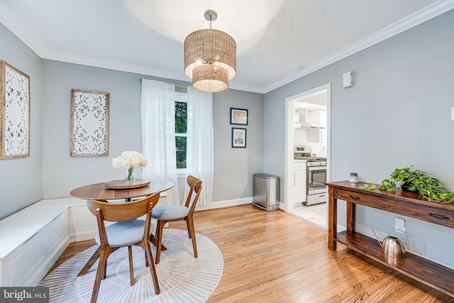 1615 Webster St NE, Washington, DC 20017 - dining space featuring light wood-type flooring, a chandelier, and ornamental molding