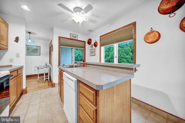 20 Grove Ave, Flourtown, PA 19031 - kitchen with white dishwasher, range, ceiling fan, light tile patterned floors, and light countertops