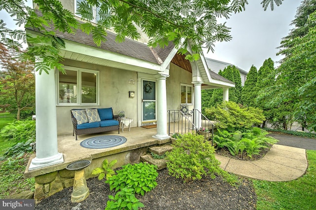 20 Grove Ave, Flourtown, PA 19031 - doorway to property with stucco siding and roof with shingles