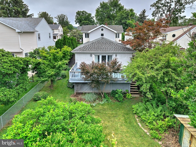 20 Grove Ave, Flourtown, PA 19031 - rear view of house with a wooden deck, stairs, stucco siding, and a shingled roof