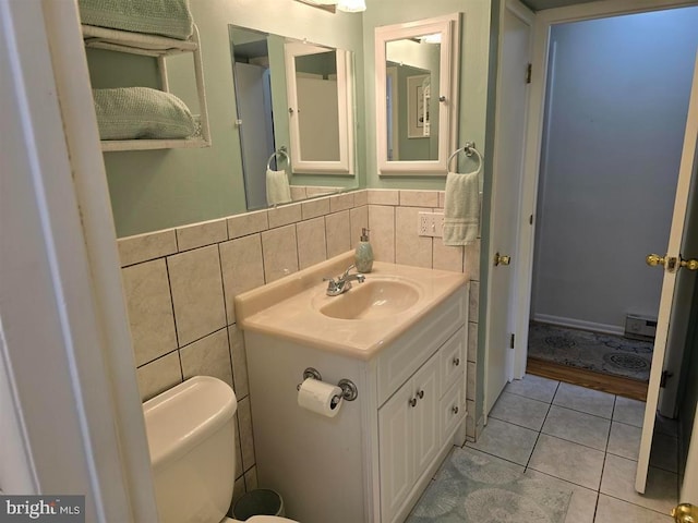 1 Lighthouse Cv, Brigantine, NJ 08203 - bathroom featuring vanity, tile walls, tile patterned floors, and a wainscoted wall