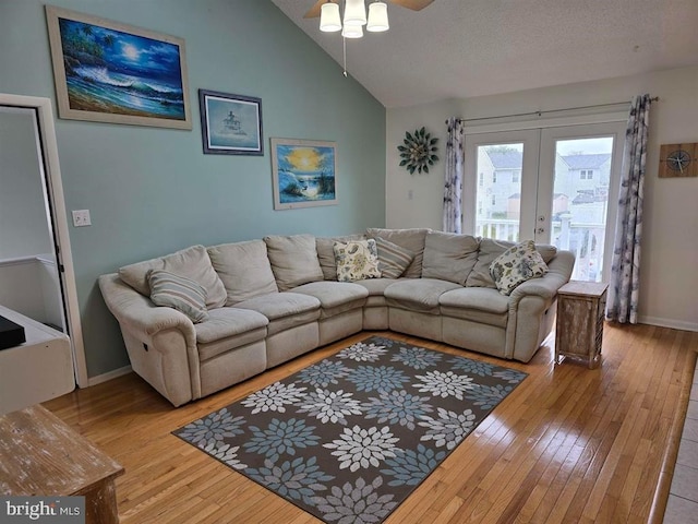 1 Lighthouse Cv, Brigantine, NJ 08203 - living room featuring wood-type flooring, a ceiling fan, french doors, and lofted ceiling