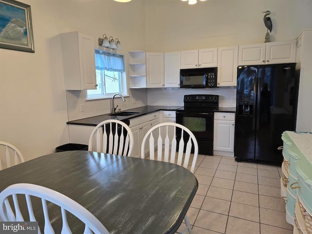 1 Lighthouse Cv, Brigantine, NJ 08203 - kitchen featuring black appliances, white cabinets, and decorative backsplash